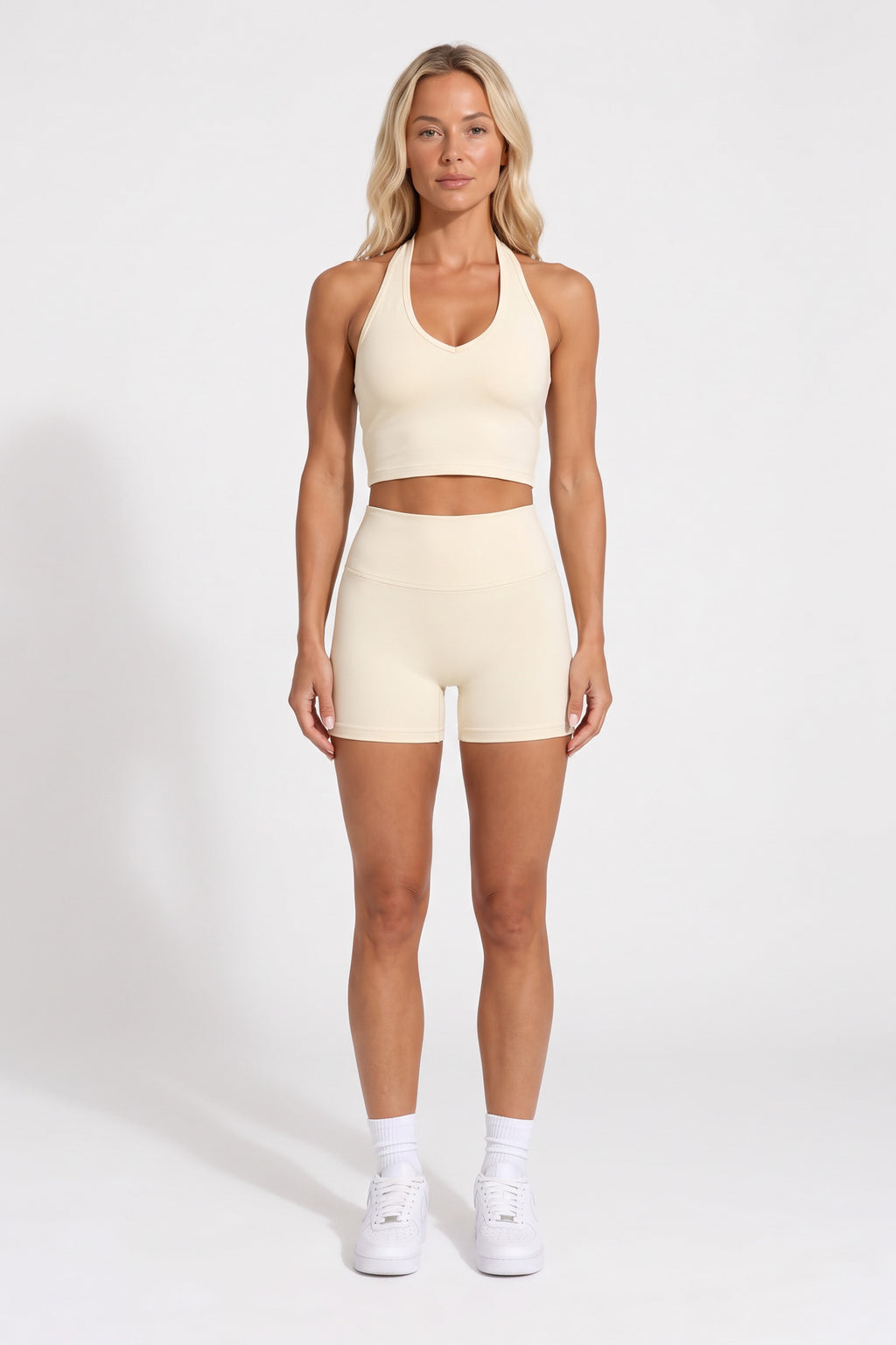 Buttercream organic cotton high-waisted shorts and halter top, full-length view.