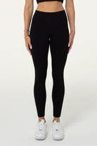 Black organic cotton high-waisted 7/8 leggings, full-length front view.