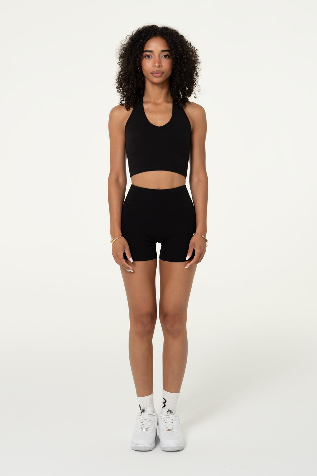 Black organic cotton high-waisted shorts, front view showing the fit.