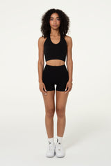 Black organic cotton high-waisted shorts, front view showing the fit.