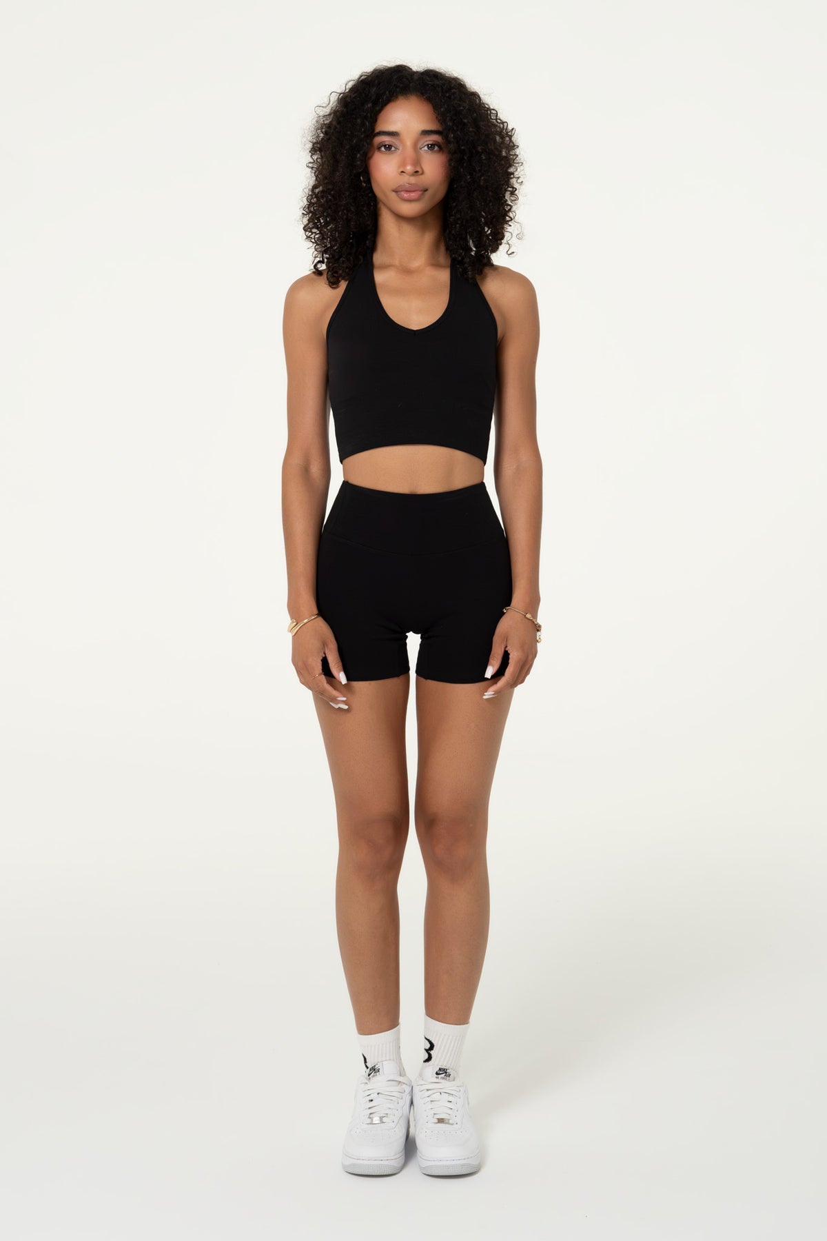 Black organic cotton high-waisted shorts, front view showing the fit.
