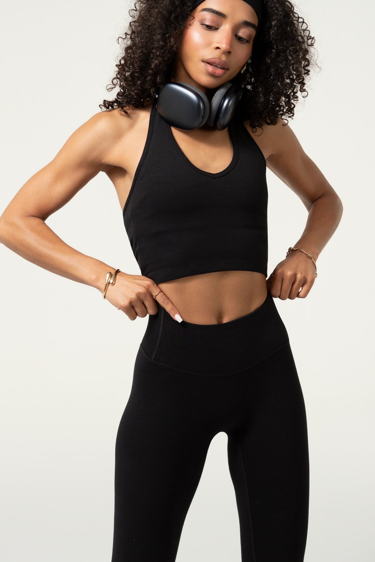 Close-up of a black organic cotton halter top with double-layer chest construction.