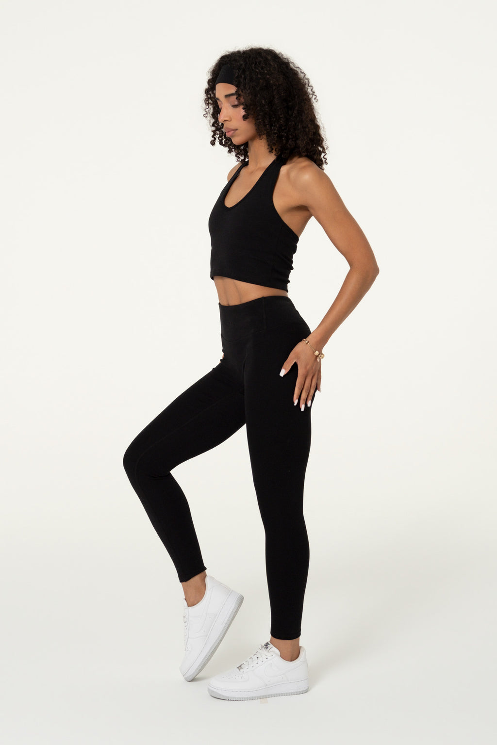 Side view of a black organic cotton halter top.