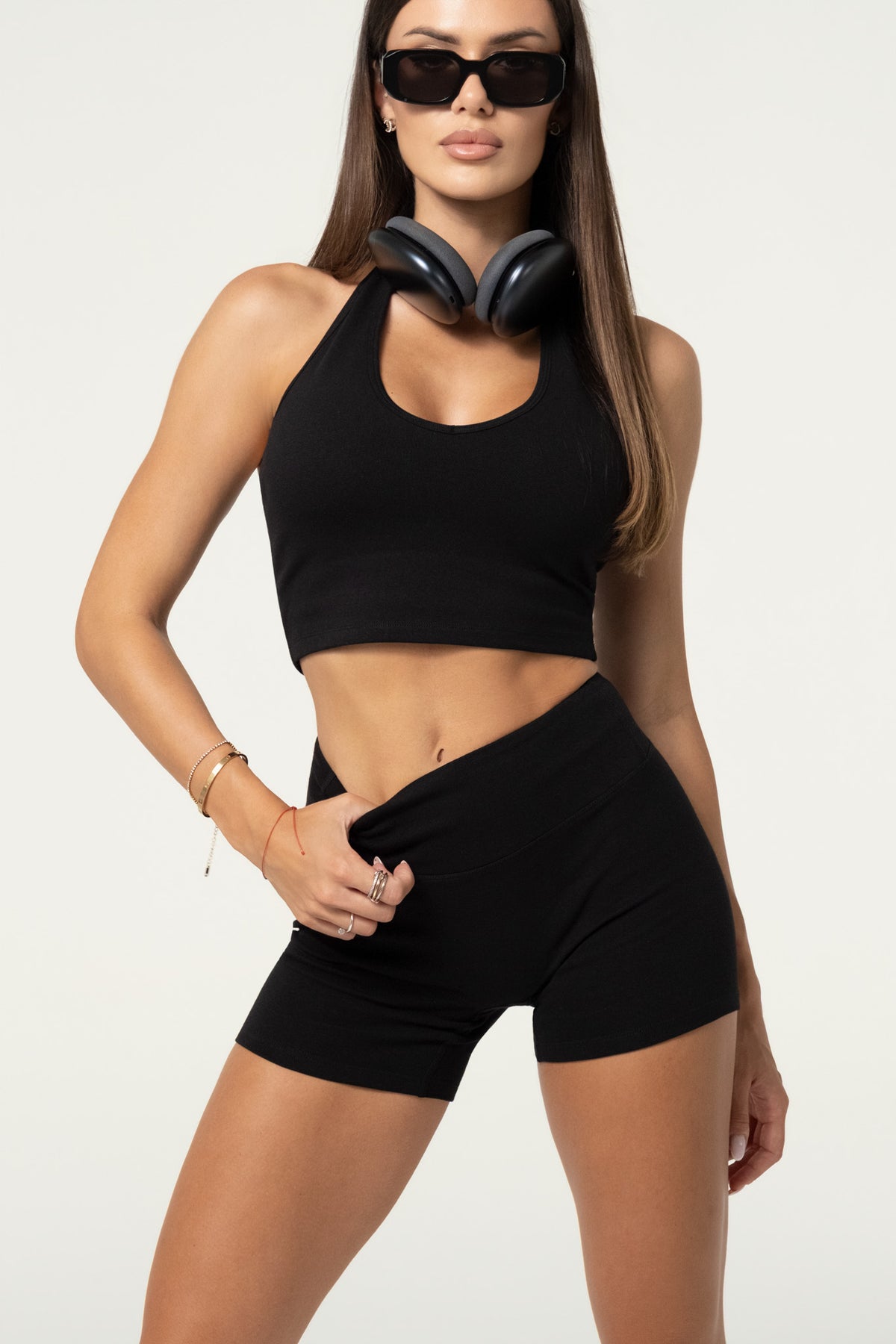 Close-up of black organic cotton shorts with a wide waistband and seamless front.
