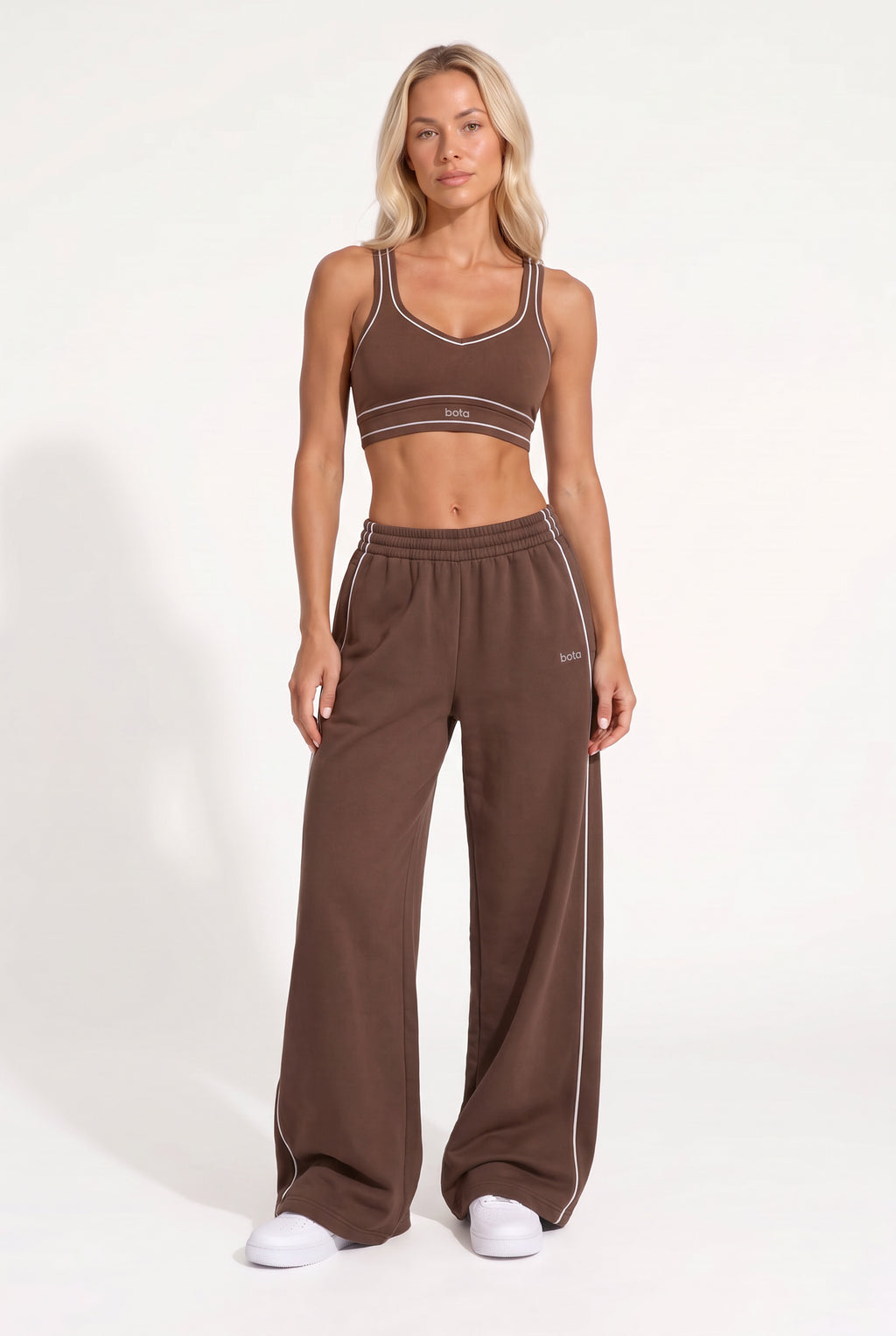 Chestnut brown organic cotton sports bra and matching sweatpants, full-length view.
