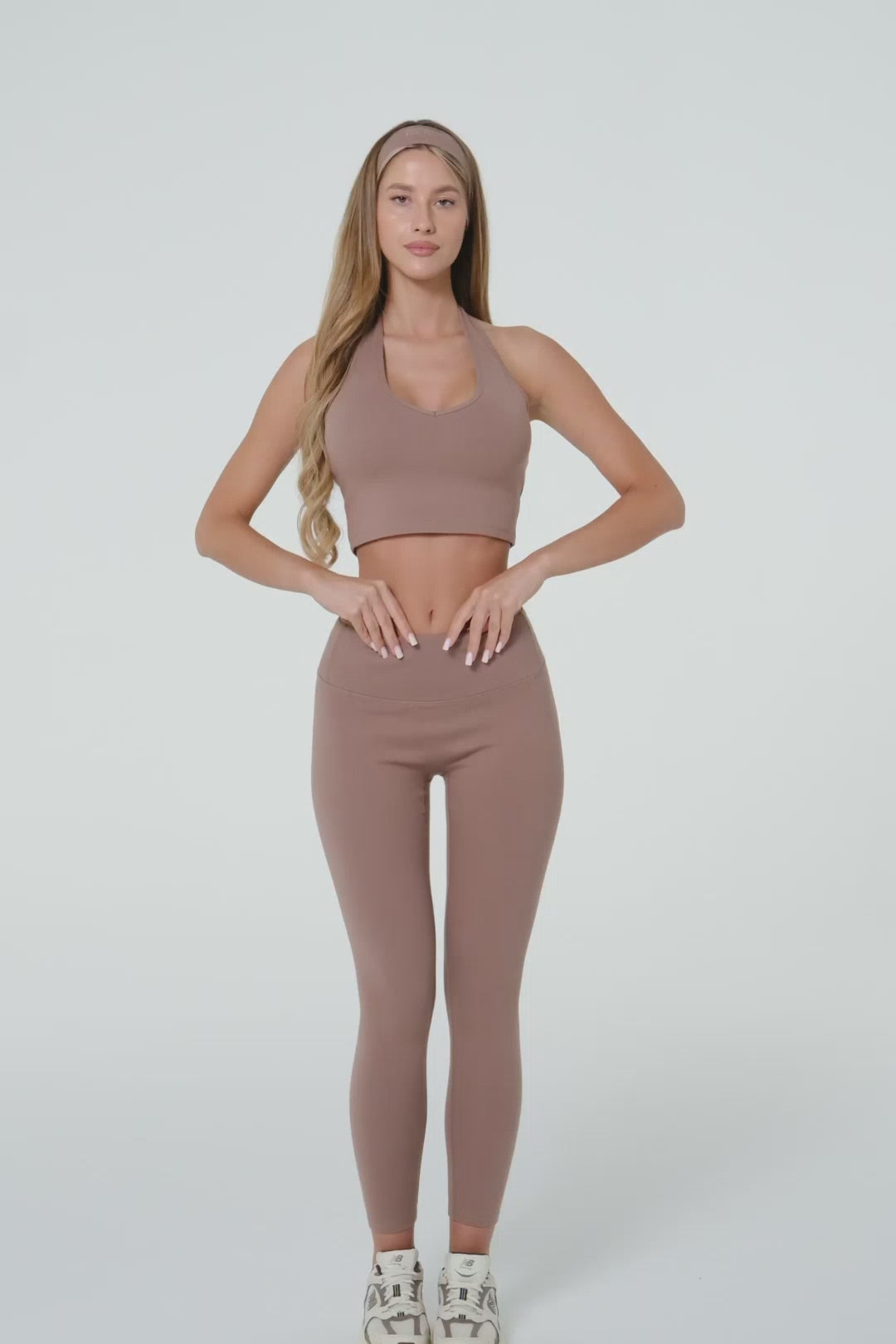 Model wearing a truffle brown organic cotton halter top.